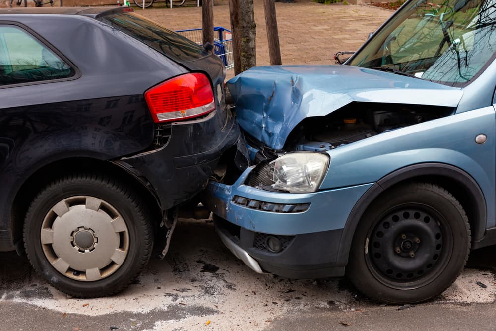 Two damaged vehicles after a rear-end car collision in Florence, AL