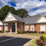 McCutcheon & Hamner, P.C. office in Florence, Alabama, featuring a brick facade and landscaped surroundings.