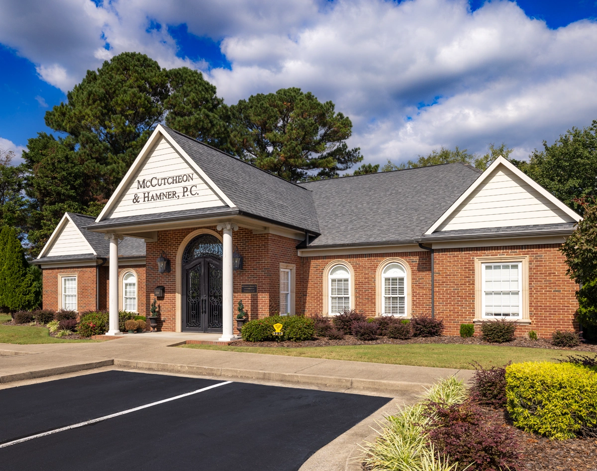 McCutcheon & Hamner, P.C. office in Florence, Alabama, featuring a brick facade and landscaped surroundings.