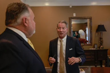 Attorney joel hamner and tom mccutcheon discuss a claim for injuries from a falling debris incident.
