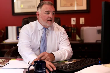 Attorney joel hamner discusses a wrongful death exhibit with a client, focusing on key trial evidence.