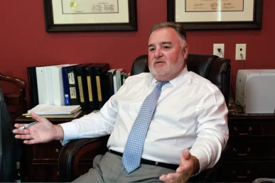 Attorney joel hamner discusses an emotional distress exhibit with a client, covering psychological evaluations.