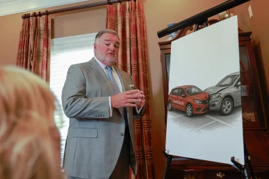 Attorney joel hamner explains a doordash accident exhibit to a client, highlighting delivery route details.