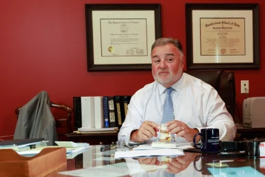 Attorney joel hamner presents a social security disability exhibit to a client, outlining benefits documentation.