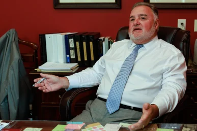 Attorney joel hamner presents a delivery truck accident exhibit to a client, highlighting gps evidence.
