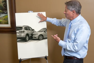 Attorney tom mccutcheon discussing a fender bender using a visual exhibit of an accident scene.