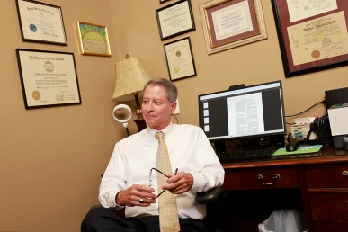 Attorneys joel hamner and tom mccutcheon advise a client on a workplace injury benefits case.