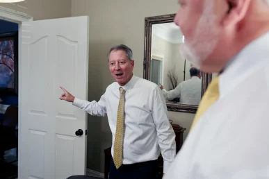 Attorneys joel hamner and tom mccutcheon examine municipal records for a sanitation truck crash case.