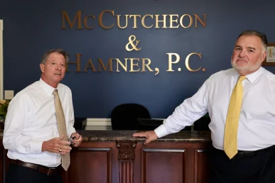 Attorneys joel hamner and tom mccutcheon plan compensation strategies for a severe joint or ligament injury.
