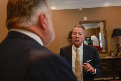 Attorneys tom mccutcheon and joel hamner consult on a restaurant delivery driver collision claim.