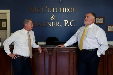 Joel hamner and tom mccutcheon analyze medical reports for a complex nerve damage claim.