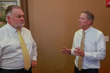 Joel hamner and tom mccutcheon review surveillance footage for a hit and run injury case.