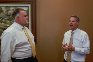 Joel hamner and lawyer tom mccutcheon strategize on a severe two vehicle impact case.