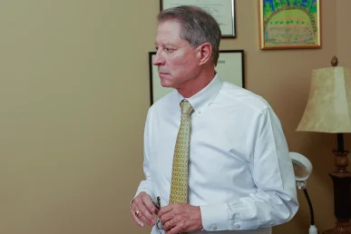 Joel hamner joins tom mccutcheon to discuss a dangerous road conditions case with a client.