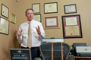 Joel hamner joins tom mccutcheon to discuss an insurance litigation claim with a client.