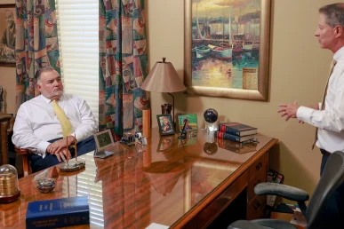 Joel hamner joins tom mccutcheon to evaluate a paralysis injury lawsuit with a client.