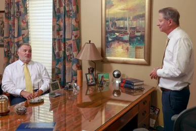 Joel hamner joins tom mccutcheon to evaluate a rollover accident case with a client.