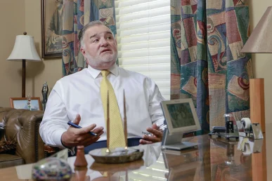 Joel hamner joins tom mccutcheon to talk with a client about a defective car seat claim.