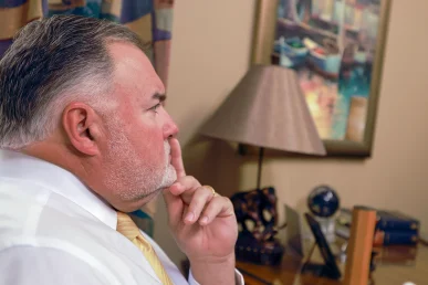 Joel hamner joins tom mccutcheon to talk with a client about a hotel accident case.