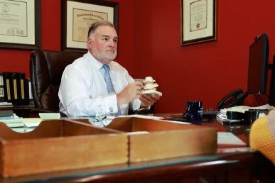 Lawyer joel hamner presents a boat and jet ski accident exhibit to a client, covering water safety details.