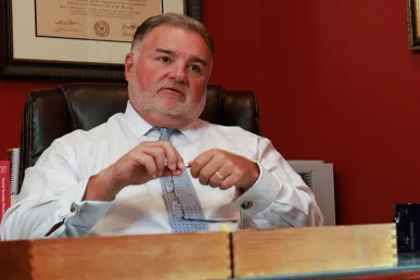 Lawyer joel hamner presents a side impact collision exhibit to a client, highlighting door intrusion evidence.