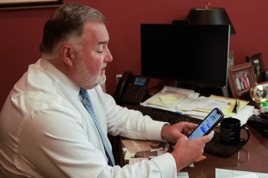 Lawyer joel hamner presents an instacart accident exhibit to a client, covering delivery route details.