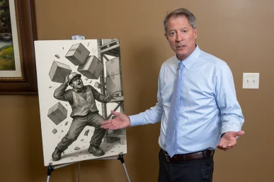 Lawyer tom mccutcheon discusses a falling object accident case with coordinating exhibits.