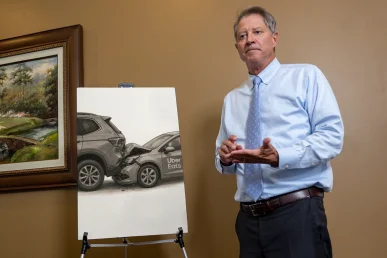 Lawyer tom mccutcheon examines an uber eats accident exhibit with delivery app data.