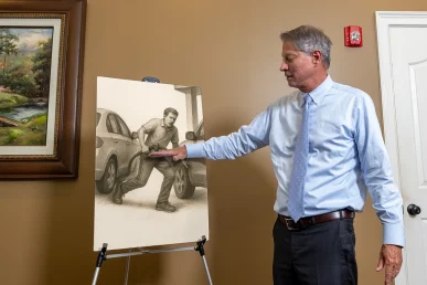 Lawyer tom mccutcheon explains a runaway vehicle exhibit featuring brake failure analysis.