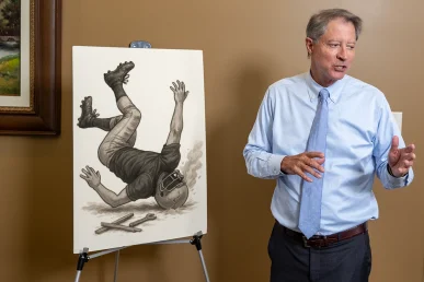 Lawyer tom mccutcheon highlights a concussion and tbi exhibit with impact diagrams and medical findings.
