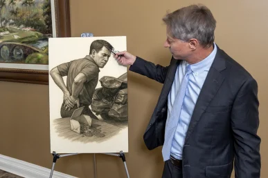 Lawyer tom mccutcheon highlights a lumbar injury exhibit with mri scans and physical therapy documentation.