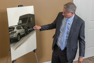 Lawyer tom mccutcheon presents a ups accident exhibit featuring delivery logs and route details.