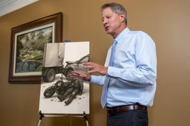 Lawyer tom mccutcheon presents an amputation injury exhibit highlighting surgical records and prosthetic care plans.