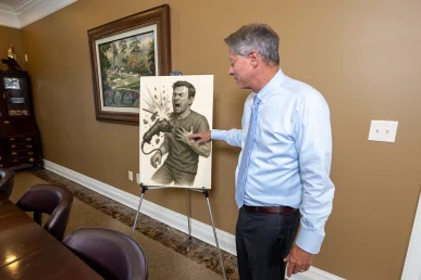 Lawyer tom mccutcheon reviews a product liability exhibit showing defective design diagrams.