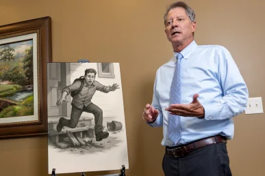 Lawyer tom mccutcheon reviews a vacation rental liability exhibit showing unsafe property conditions.