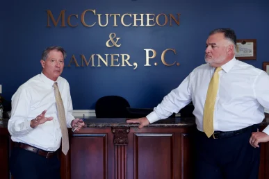 Lawyers tom mccutcheon and joel hamner assess audiology tests while preparing a noise exposure injury case.