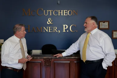 Lawyers tom mccutcheon and joel hamner examine driver logs for a rideshare collision claim.