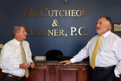 Lawyers tom mccutcheon and joel hamner review neglect evidence for a nursing home abuse case.
