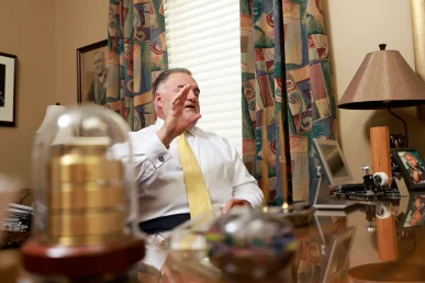 Lawyers tom mccutcheon and joel hamner strategize on a high speed collision lawsuit.
