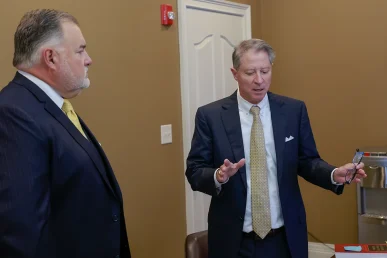Partners joel and tom strategize on how to win an upcoming delivery accident trial.