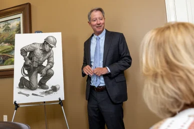 Personal injury attorney tom mccutcheon discusses a joint injury claim with a client.