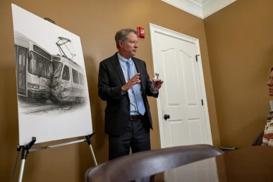 Personal injury attorney tom mccutcheon discusses a public transportation accident case with a client.