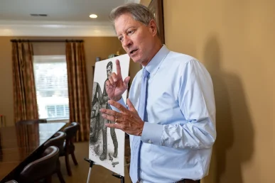 Personal injury attorney tom mccutcheon discusses a scars and disfigurement case with a client.