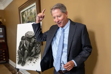 Personal injury attorney tom mccutcheon discusses an emotional distress claim with a client.