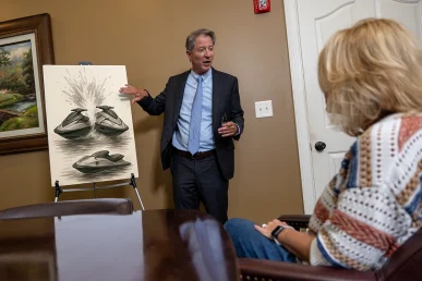 Personal injury attorney tom mccutcheon meets a client to evaluate a boat and jet ski accident claim.