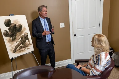 Personal injury attorney tom mccutcheon meets with a client in the mccutcheon & hamner conference room to discuss an atv and utv accident claim.