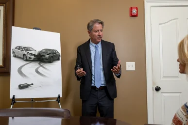 Personal injury attorney tom mccutcheon meets with a client to consider a drunk driving accident lawsuit.