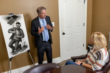 Personal injury attorney tom mccutcheon meets with a client to evaluate a landlord liability injury case.