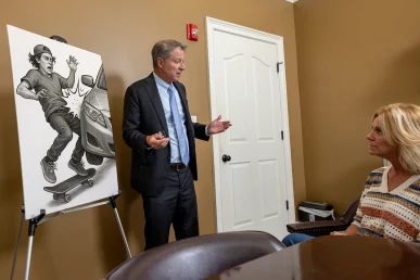 Personal injury attorney tom mccutcheon meets with a client to evaluate a skateboard accident case.