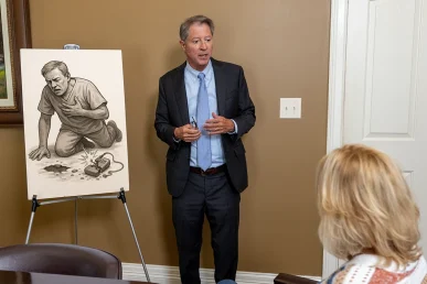 Personal injury attorney tom mccutcheon meets with a client to examine a defective medical device lawsuit.